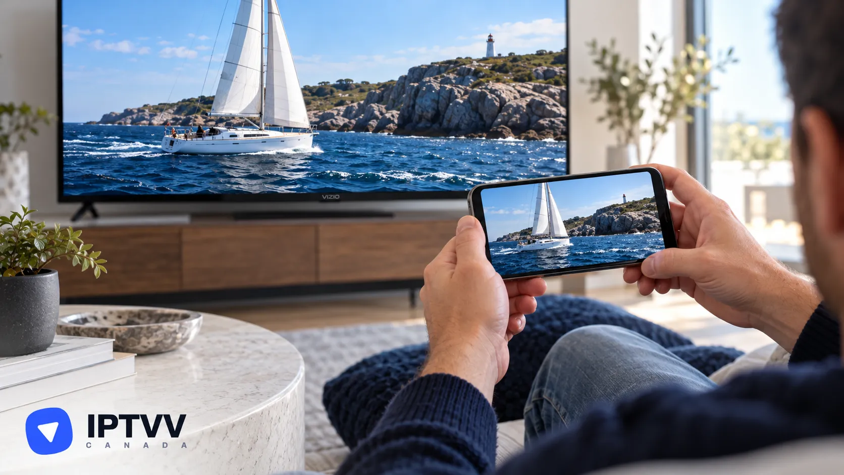 A phone casting a sailing video to the TV behind it