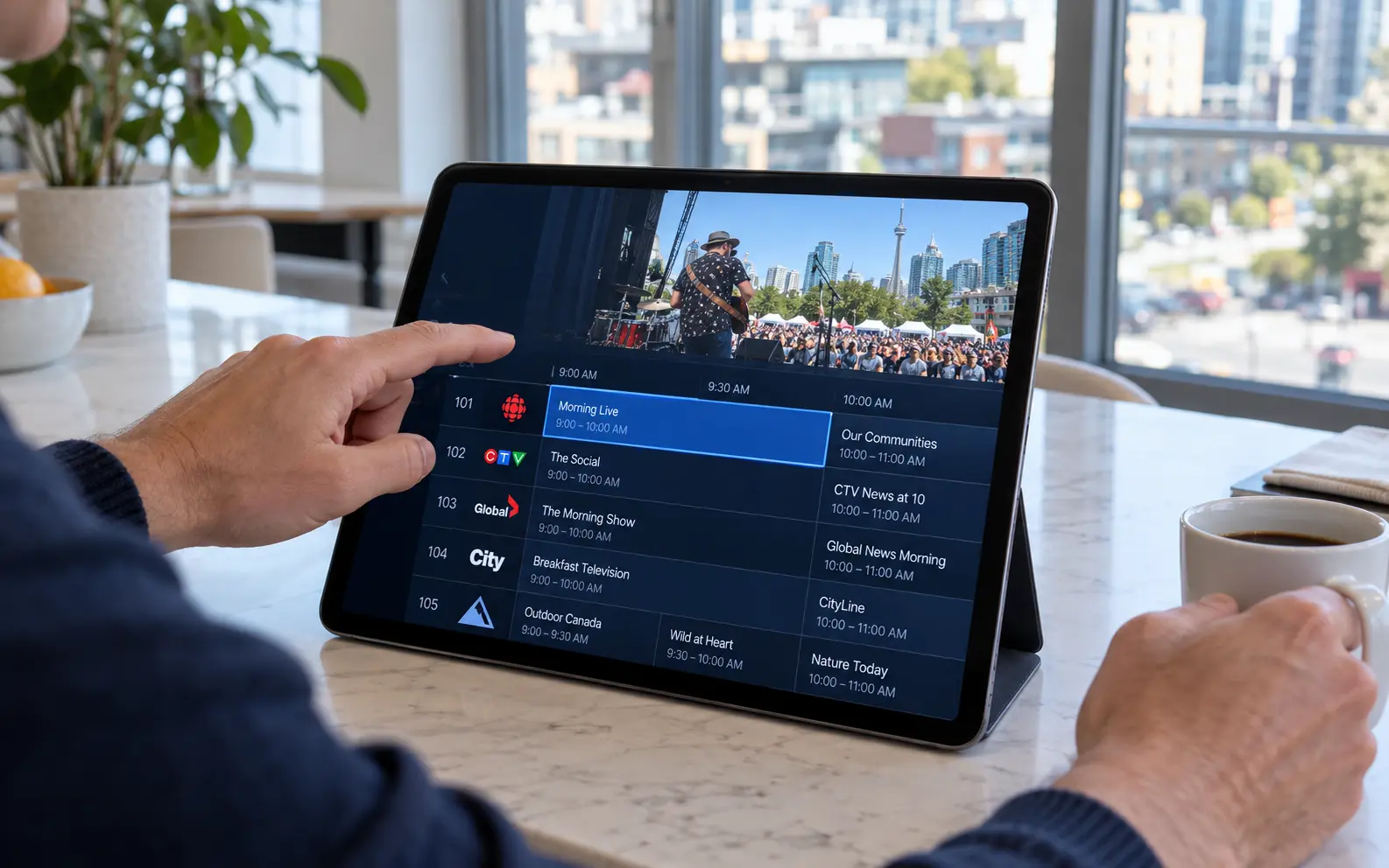 A hand scrolling the IPTV Canada live TV program guide on a tablet